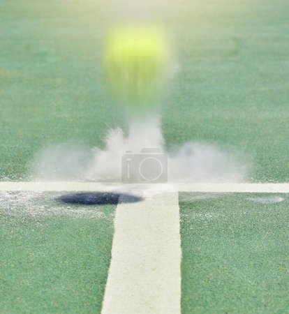Photo for Tennis, sport and training with a ball on a court bouncing during a game to score a point or winner. Sports, scoring and boundary with a match playing on a field with chalk and artificial grass. - Royalty Free Image