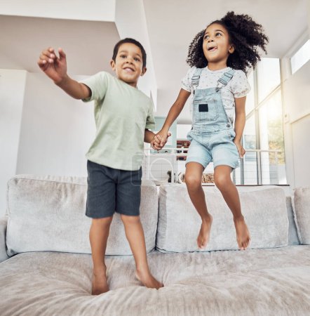 Photo for Children, brother and sister bonding and jumping on sofa in house, home or hotel living room in fun, play and energy game. Smile, happy or adhd kids or hyperactive Mexico boy and girl with sugar rush. - Royalty Free Image