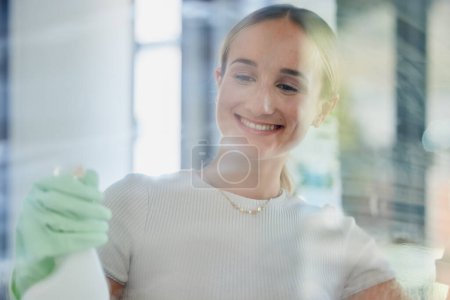 Photo for Smile, home and woman cleaning window, housework or washing shower cabin. Hygiene, glass and happy female from Canada in rubber gloves, scrub and spring cleaning, sanitize for germ free living space - Royalty Free Image