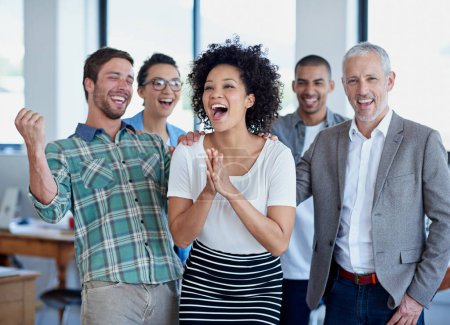Photo for Celebrating their business success. a group of happy coworkers celebrating standing in an office - Royalty Free Image
