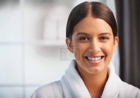 Photo for Her happy skin glows. Portrait of a beautiful young woman wearing a white robe - Royalty Free Image