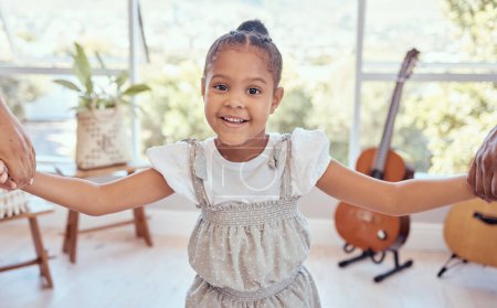 Girl in living room, portrait of kid holding hands for family support in child care or learning trust in Mexico home. Happy young kindergartener with smile on face, apartment lounge or kids happiness.