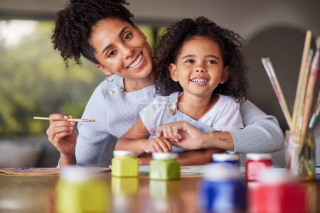 Photo for Painting, girl and mother bonding in creative art activity in home or house for school, learning and education project. Portrait, smile and happy Brazilian mom helping family child in fun color class. - Royalty Free Image