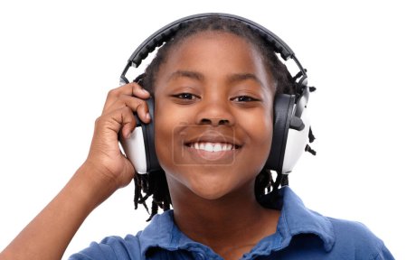 Photo for This songs got some great beats. An African-American boy listening to music over his headphones - Royalty Free Image