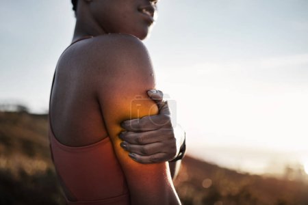 Black woman, arm pain and exercise injury after training accident outdoors. Sports, fitness and female athlete with fibromyalgia, inflammation or sore muscles after cardio workout, running or jog