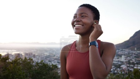 Photo for Fitness, headphones or black woman in nature to start running exercise, cardio workout or marathon training. Sunset, earbuds or happy African girl streaming radio music, podcast or audio playlist. - Royalty Free Image