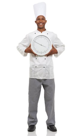 Foto de Nosotros los chefs siempre estamos en el reloj. Retrato de un chef africano sosteniendo un reloj - Imagen libre de derechos