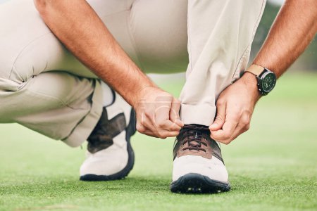 Photo for Shoes, start and man tying laces for golf, preparing for sport and training for a competition. Ground, prepare and golfer ready for a game of sports, tightening a lace and on the course for a hobby. - Royalty Free Image