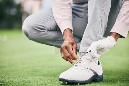 Photo for Closeup, golf and man tie shoelace, fitness and success with game, playing and workout outdoor. Male athlete, guy and player, tying laces and training for match, competition and sports for wellness. - Royalty Free Image