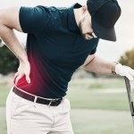 Sports, muscle and golf, man with back pain during game on course, massage and relief in health and wellness. Green, hands on injury in support and golfer with body ache at golfing workout on grass