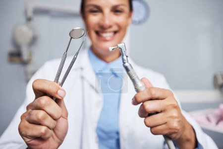 Photo for These clean like a dream. Portrait of a young woman holding teeth cleaning tools in her dentists office - Royalty Free Image