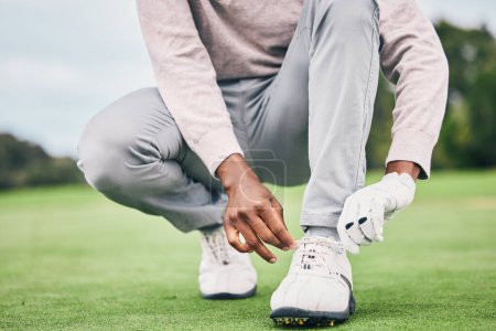 Photo for Sports, laces and shoes of man on golf course for training, games and tournament match. Ready, start and tying with male athlete playing in club on lawn field for relax, golfing and competition. - Royalty Free Image