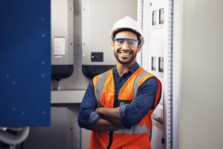 Photo for Portrait, happy man and engineering technician in control room, inspection service or industry maintenance. Electrician, arms crossed and smile in electrical substation, system or industrial mechanic. - Royalty Free Image