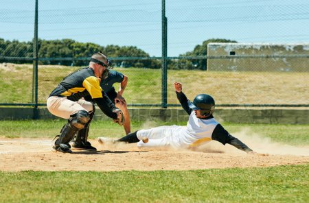 Photo for In baseball you need to be up for the challenge. Full length shot of a young baseball player reaching base during a match on the field - Royalty Free Image