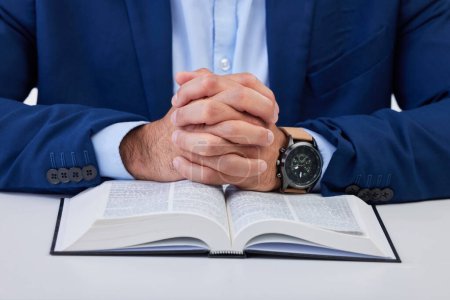 Photo for Closeup, hands and man with bible, praying and guidance with higher power, hope and spiritual. Zoom, male and Christian with holy book, scripture and religious with faith, Catholic text and belief. - Royalty Free Image