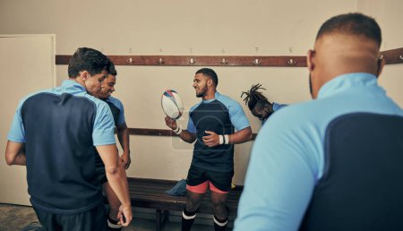 Photo for Locker room, motivation and team building, rugby players in strategy discussion or game plan with ball. Training, coaching and group of sports men planning teamwork with leader in cloakroom together - Royalty Free Image