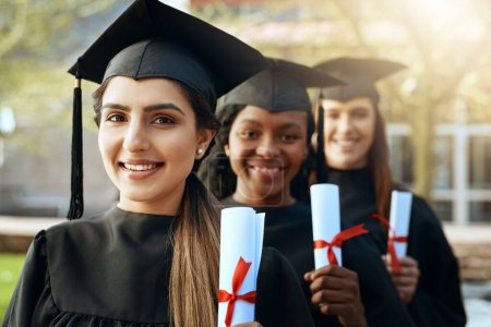 Photo for The choices we made lead us to this point. Portrait of a group of young women holding their diplomas on graduation day - Royalty Free Image