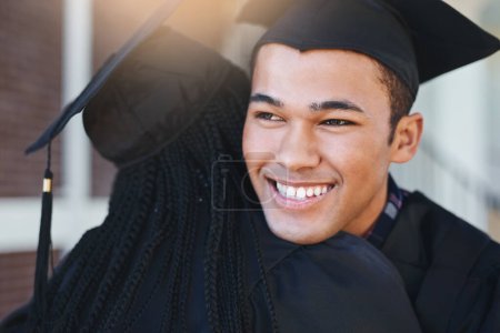 Photo for Live the life youve imagined. two happy young students hugging each other on graduation day - Royalty Free Image