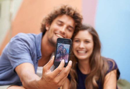 Photo for Say cheese. a young couple taking a selfie on a mobile phone - Royalty Free Image