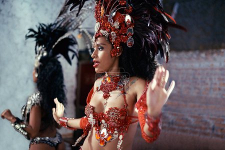 The main attraction. two beautiful samba dancers performing in a carnival