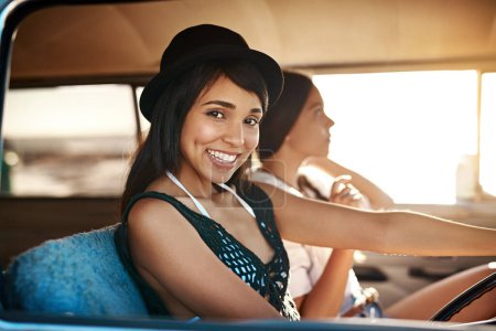 Photo for Lets go somewhere beautiful. Portrait of a happy young woman enjoying a road trip with her friend - Royalty Free Image