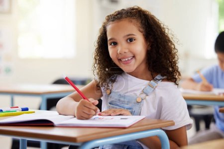 Photo for Learning, drawing and portrait of girl in classroom exam, education or studying with book. Preschool smile, development and happy kid or student coloring for creative art in notebook in kindergarten - Royalty Free Image
