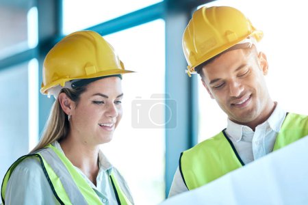 Photo for Architect, team and planning with blueprint for construction or architecture with smile for on site project. Man and woman contractors in building floor plan or teamwork strategy with safety helmets. - Royalty Free Image