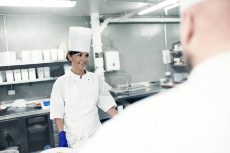 Photo for Service with a smile. the inner working of a professional kitchen - Royalty Free Image