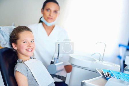 Photo for Now thats a perfect smile. Portrait of a young girl have a checkup at the dentist - Royalty Free Image