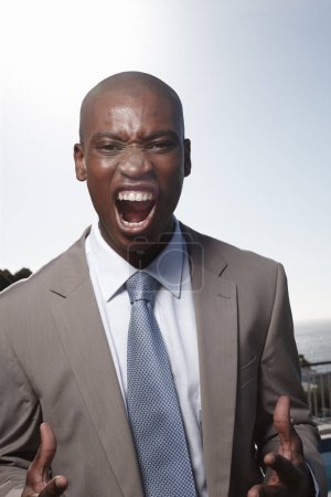 Photo for Lets DO this. A portrait of an enthusiastic businessman shouting and gesturing outdoors - Royalty Free Image