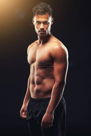 Strong is not just physical strength, its a mindset. Studio shot of a fit young man isolated on black