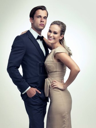 Hes a hit with the ladies. A studio portrait of a couple in stylish vintage evening wear