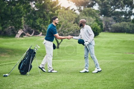 Photo for Men, golf course grass and handshake for friends at game, sport and international competition on field. Professional golfer, start and shaking hands for fitness at contest, club and sports in summer. - Royalty Free Image