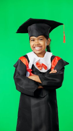 Photo for Graduation, education and child smile on green screen for graduate, academy ceremony and award. Primary school, student and portrait of young girl for kindergarten, achievement and success in studio. - Royalty Free Image
