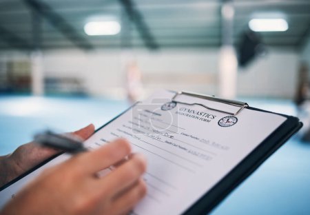Photo for Hand, documents and contract in gym with a coach watching a performance for membership sign up or checklist. Paper, assessment and personal trainer in a sports center for fitness, planning or review. - Royalty Free Image