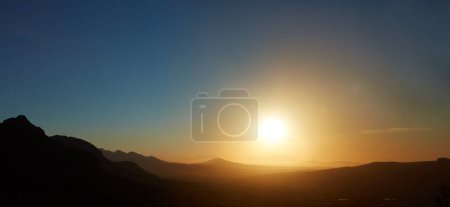 Photo for Gold from the heavens. the sun setting over the horizon - Royalty Free Image