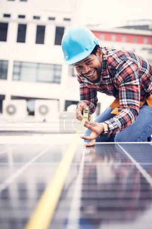 Engineer man, measuring tape or solar panel on rooftop for sustainable planning, renewable energy or development. African technician smile, photovoltaic system or roof installation with measurement.