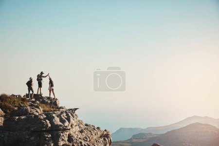 Photo for The purpose of life is to live it. a group of friends hiking up a mountain - Royalty Free Image