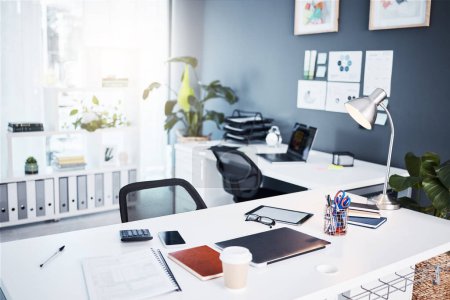 Empty office, interior and business with table, professional layout and desk in startup agency. Background of modern workplace, building and furniture in company, workspace and setup in bright room.