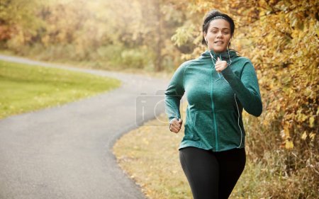 Photo for Mother Nature makes the best workout buddy. an attractive young woman going for a run in nature - Royalty Free Image