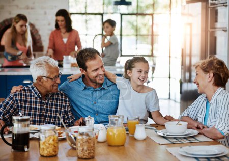 Photo for Sharing breakfast and blessings together. a multi generational family enjoying breakfast together at home - Royalty Free Image