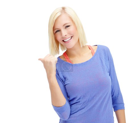 Photo for Excited about your product. A beautiful young blond woman pointing towards copyspace while isolated on white - Royalty Free Image
