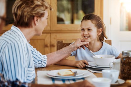 Photo for Have I told you how cute you are, my dear. a little girl having breakfast with her grandmother at home - Royalty Free Image
