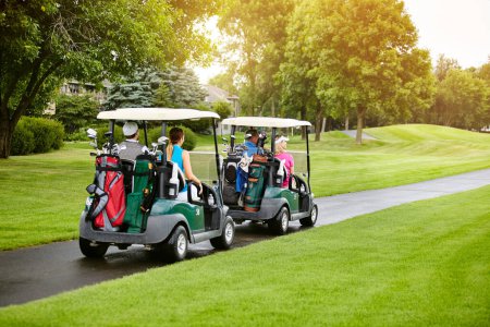 Photo for Getting a great foursome together for some golf. four people out on a double date on a golf course - Royalty Free Image
