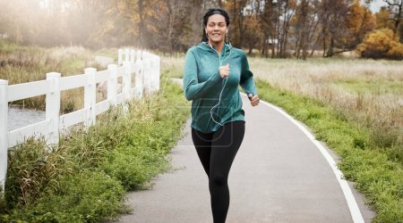 Photo for And so begins her journey into fitness. an attractive young woman going for a run in nature - Royalty Free Image