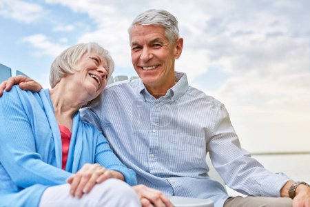 Photo for If this isnt true love then nothing is. Portrait of an affectionate senior couple relaxing on chairs together outside - Royalty Free Image