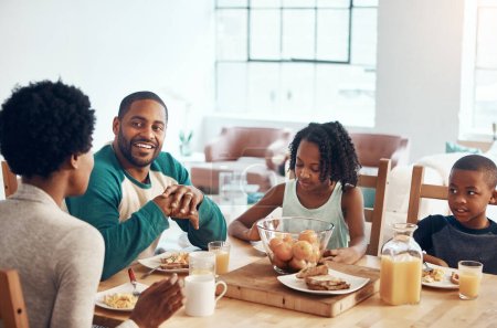 Photo for Start the day with family, laughter and food. a family having breakfast together at home - Royalty Free Image