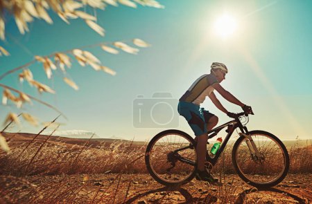 Photo for Dont let anything stop you from pedaling. a man out cycling in the countryside - Royalty Free Image