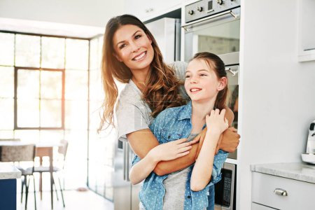 Photo for Moms love brightens any day. a happy mother and daughter in a loving embrace at home - Royalty Free Image