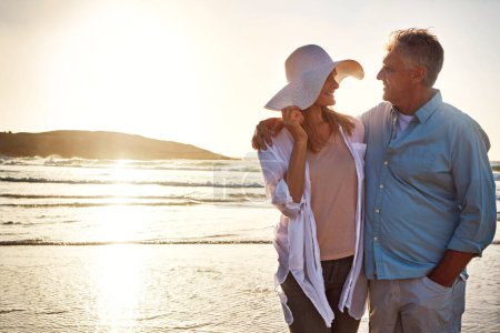 Photo for They have a connection that will never die. a mature couple spending the day at the beach - Royalty Free Image